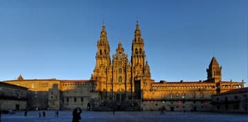 Panorama of plaza and facade at sunset.
