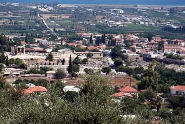 View looking north over ancient and modern Corinth, with the Gulf of Corinth in the distance.