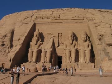 The Temple of Ramses II at Abu Simbel, completed in 1264 BC and dedicated to Ra-Harakhty, Ptah and Amun. It features four large statues of Ramses II on the facade.