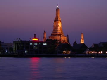 Wat Arun across the river at sunset.