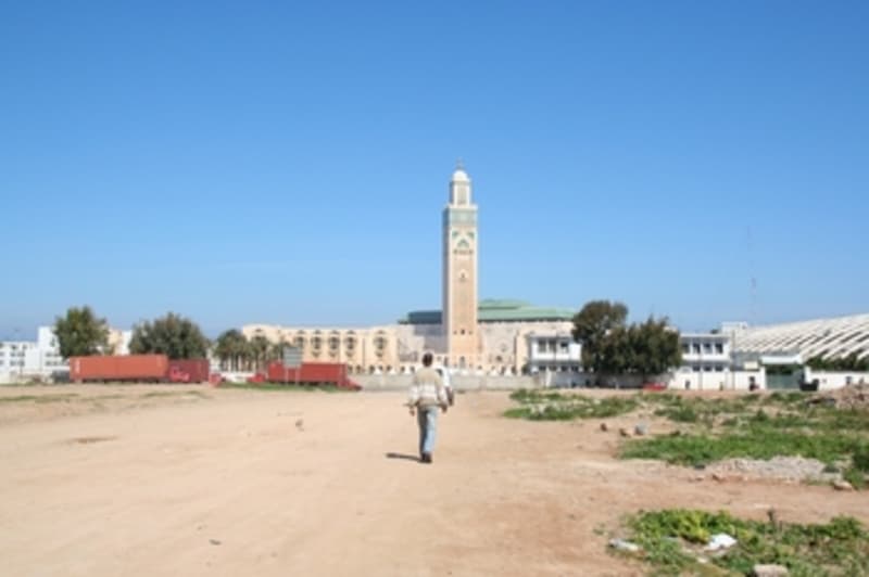 Approach to the mosque from dusty back streets.