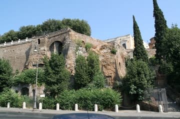 View of Capitoline Hill and the pinkish walls of the Capitoline Museum from below.