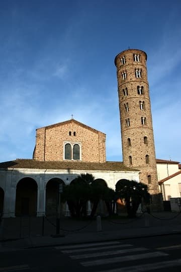 West exterior of Sant'Apollinare Nuovo, Ravenna, in evening light. The church and campanile date from c.500 AD, the portico from the 16th century.