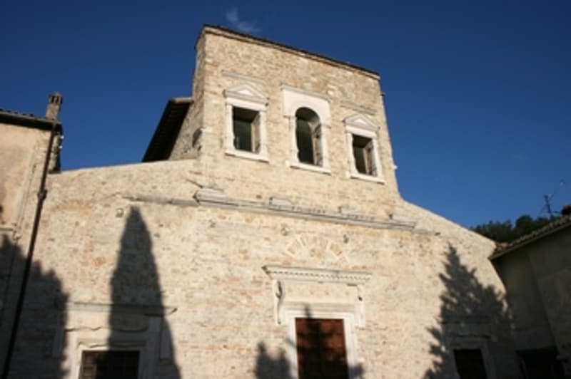 West facade, with Classical-style reliefs over the portals and windows.