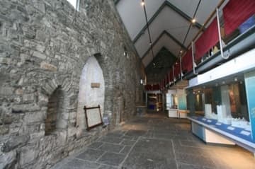 South aisle of St. Audoen's, with historical displays.