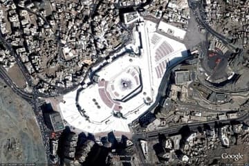 Aerial view of the Haram Mosque in the heart of Mecca, with the Ka'ba visible in the center of the courtyard.
