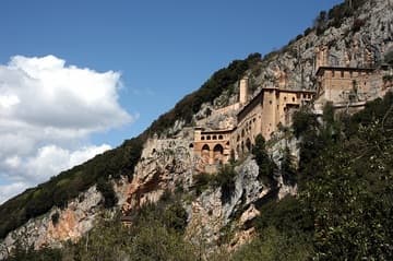 View of St. Benedict's Monastery at Subiaco, clinging to a mountain cliff.