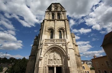 Romanesque tower and Gothic portal.