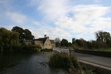 Tower of Fairford Church as seen from Mill Lane, across the River Coln.