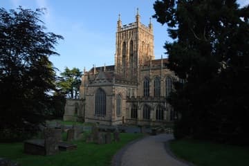 The pretty Perpendicular Gothic exterior of Great Malvern Priory, approached from the north.