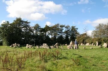 Detail of the King's Men, a stone circle dating from about 2500-2000 BC. It is almost perfectly round and has a diameter of 104 ft (33 m). Originally, there may have been as many as 105 stones, but today there are 77 stones. Over a third of the stones were put back in place during the site's restoration in 1882. The stones are of heavily-weathered local oolotic limestone. Rollright Stones, Oxfordshire, England.
