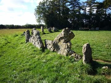 Detail of the King's Men, a stone circle dating from about 2500-2000 BC. It is almost perfectly round and has a diameter of 104 ft (33 m). Originally, there may have been as many as 105 stones, but today there are 77 stones. Over a third of the stones were put back in place during the site's restoration in 1882. The stones are of heavily-weathered local oolotic limestone. Rollright Stones, Oxfordshire, England.