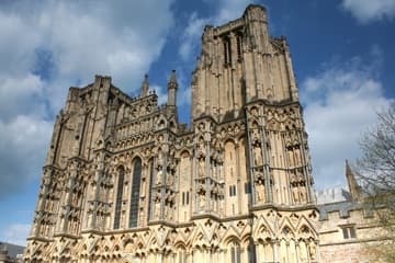 The magnificent west facade of Wells Cathedral, 1209-39. It measures 100 feet high by 150 feet wide and contains over 500 large sculptures. Wells, Somerset, England.