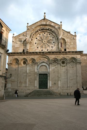 West facade of Troia Cathedral in evening light. The lower part dates from 1107-15; the upper part with rose window was added in 1160-80.