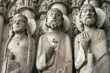 Three statues on the left side of the central bay. Detail of the west portal or Royal Portal, completed by 1150. Its celebrated sculptures show the transition from Romanesque to Gothic.
